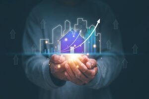Real,Estate,Business,Concept,,Man,Holding,Virtual,Screen,Of,City
